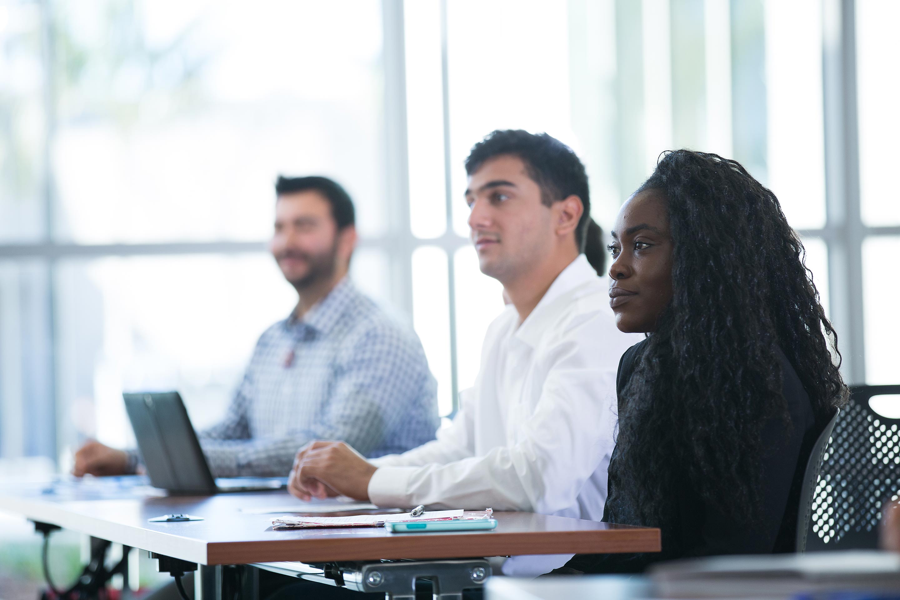 Three scholars in class